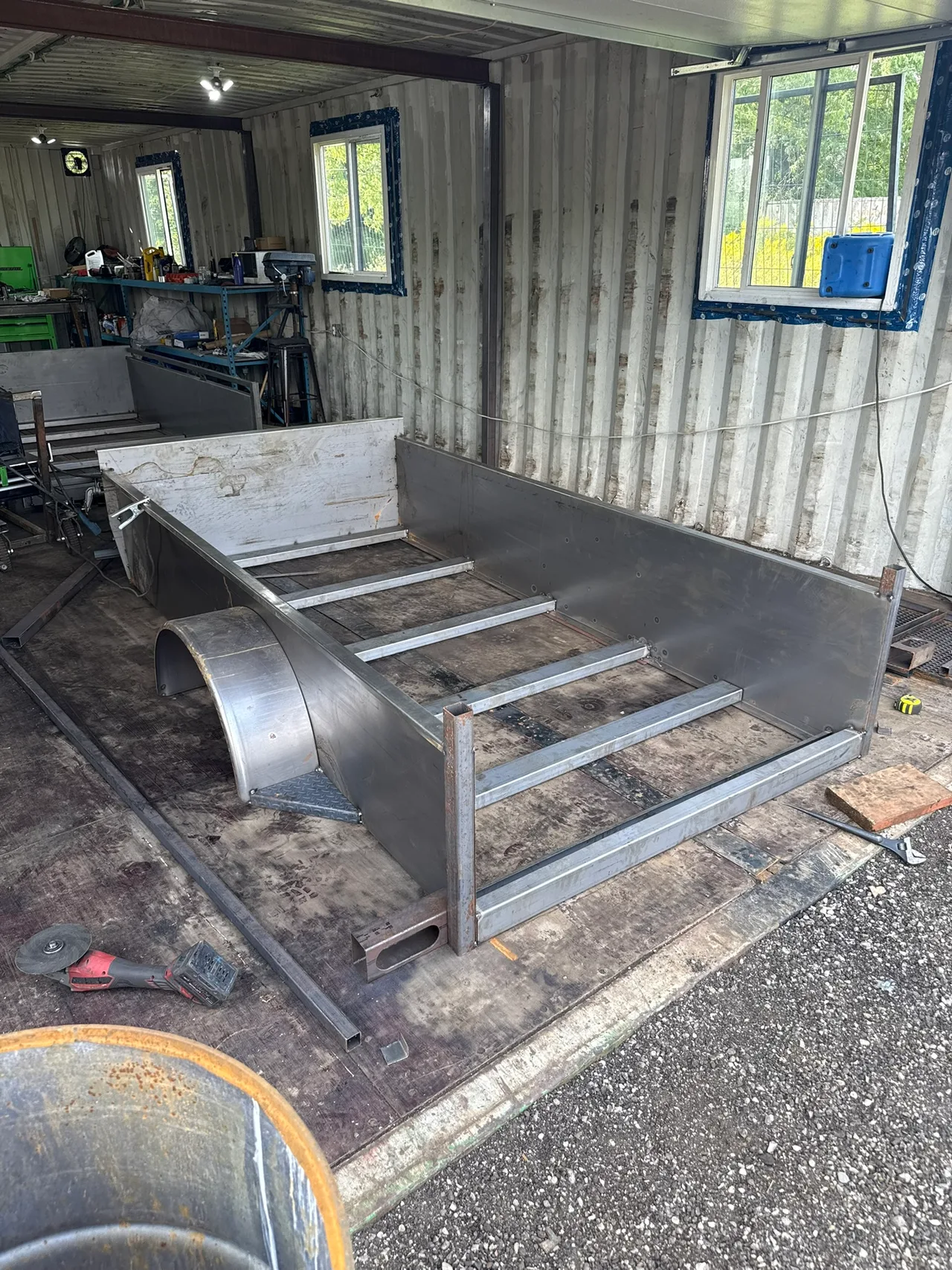 Trailer body being fabricated inside the container workshop