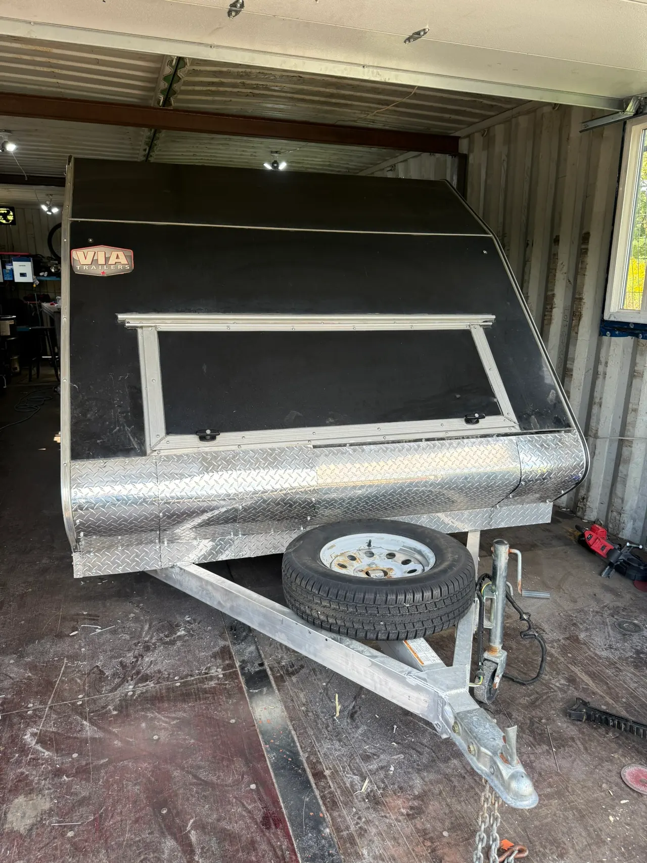 Front of a fabricated trailer body with its coupling and steel frame